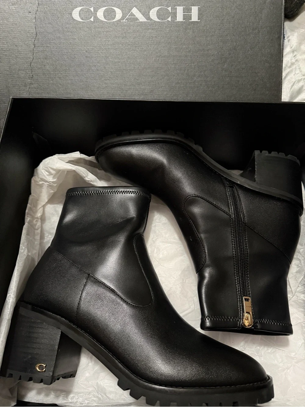 Coach Black Leather Lug Sole Ankle Boots with Gold Zip Accent
